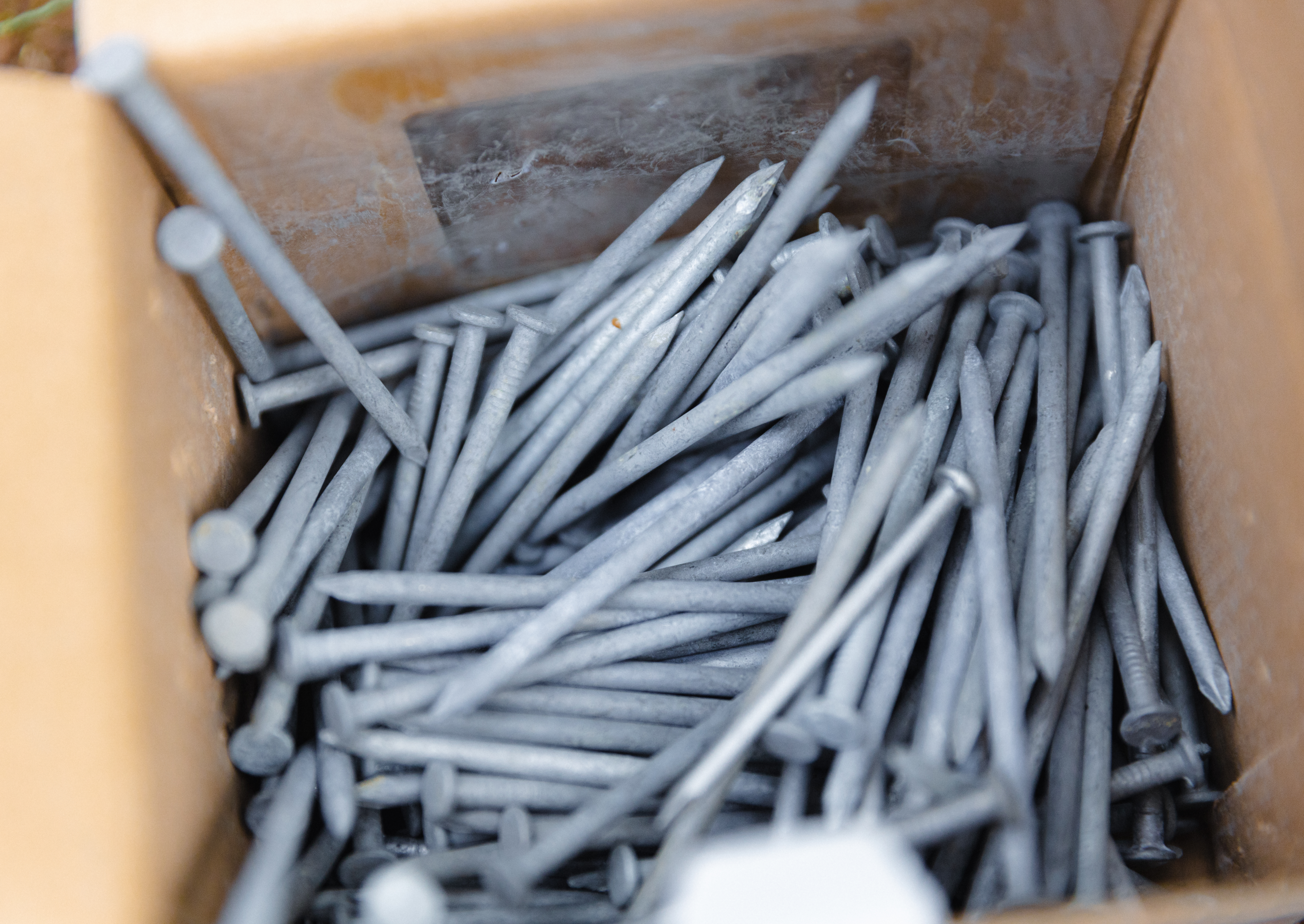 construction nails in a container