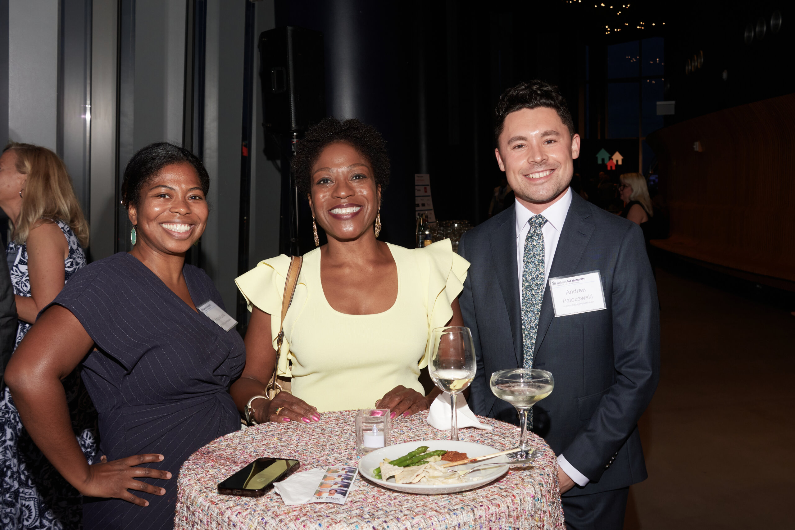 Three young professionals at an event