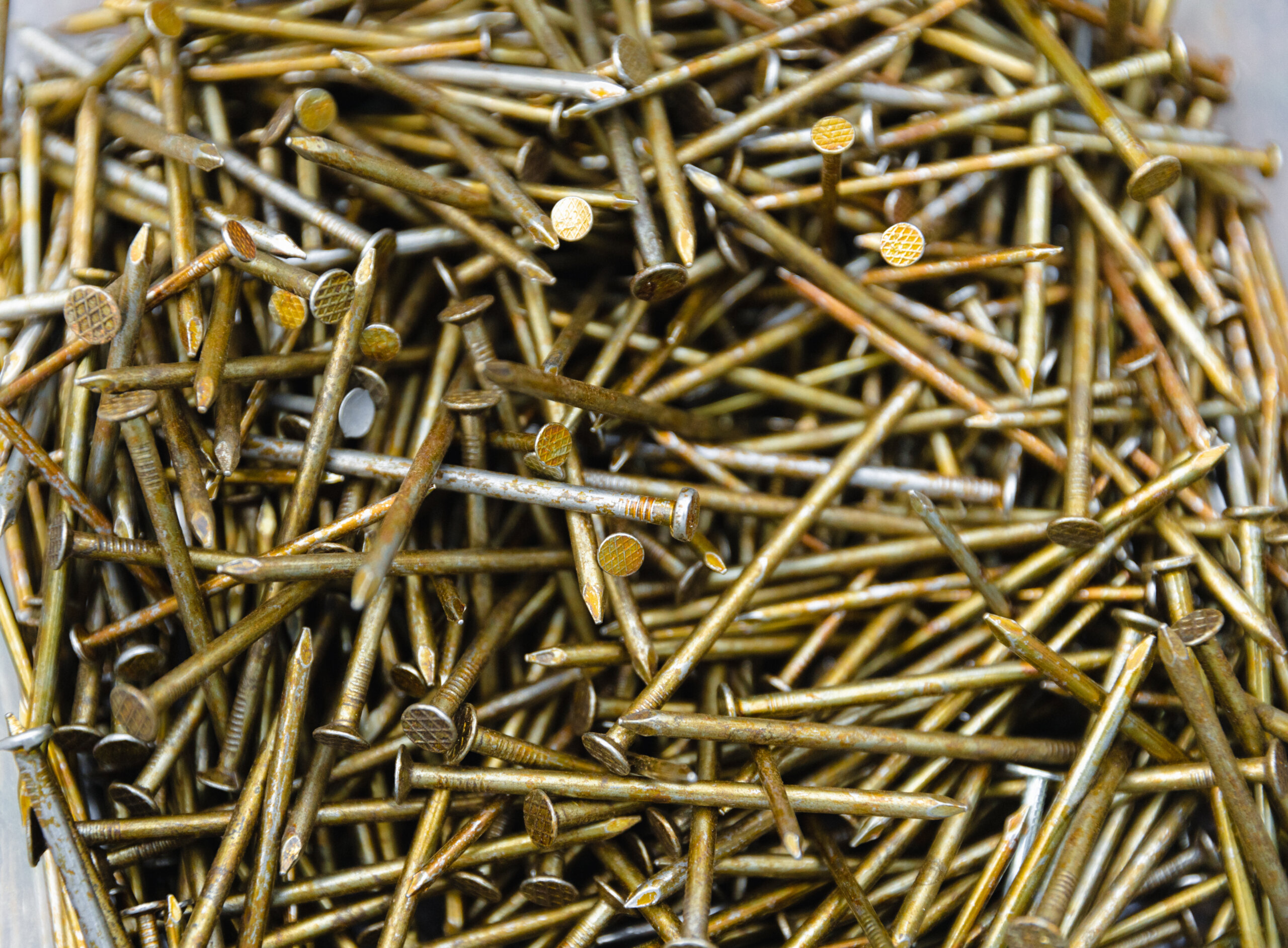 pile of construction nails
