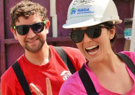 Man and woman in sunglasses smiling 
